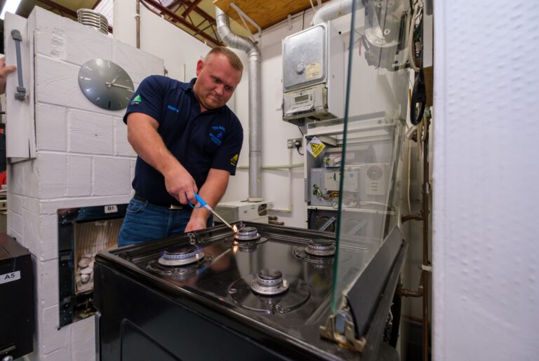 Gas engineer working on a gas hob